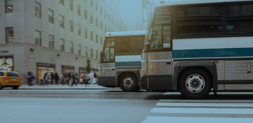 Transit buses crossing an intersection 